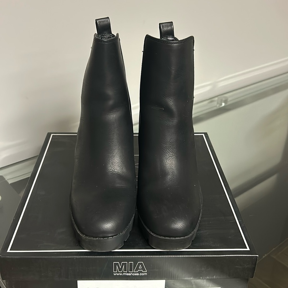 Francesca’s black booties